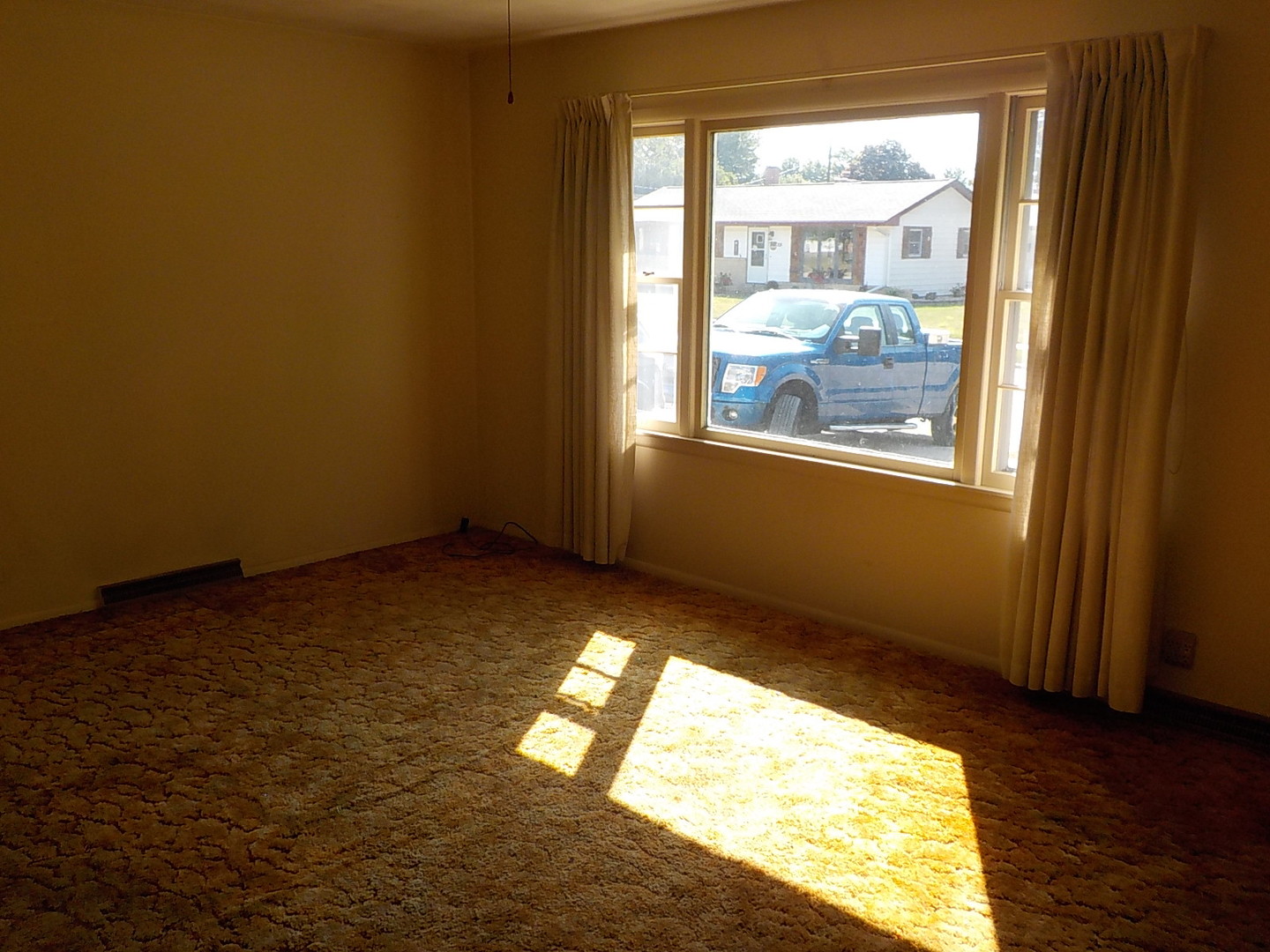 104 Janet Avenue Rochelle, IL 61068 - Photo 5 of 14 a view of an empty room and window