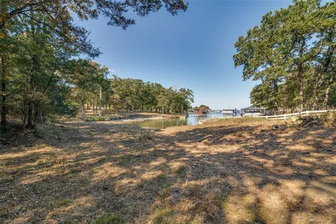 a view of outdoor space with large trees