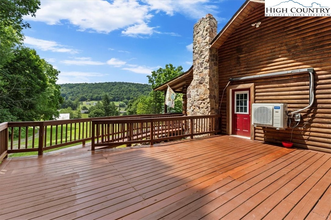 2352 Cedar Springs Road Rural Retreat, VA 24368 - Photo 34 of 50 a view of backyard with deck and outdoor seating