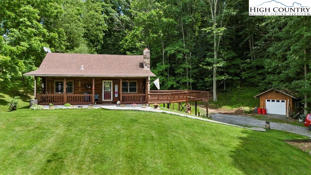 2352 Cedar Springs Road Rural Retreat, VA 24368 - Photo 4 of 50 a house view with a sitting space and garden