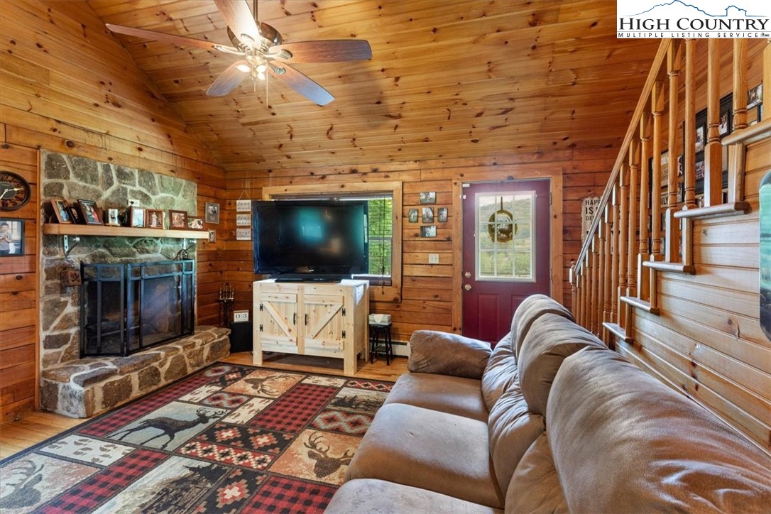 2352 Cedar Springs Road Rural Retreat, VA 24368 - Photo 8 of 50 a living room with furniture and a flat screen tv