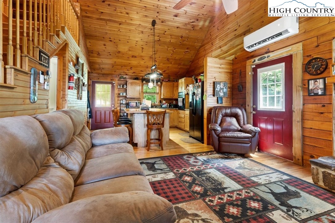 2352 Cedar Springs Road Rural Retreat, VA 24368 - Photo 10 of 50 a living room with furniture a couch and large windows