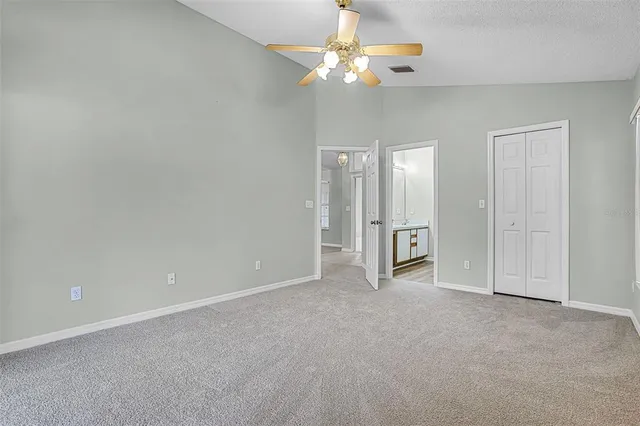 a kitchen with a sink and a mirror