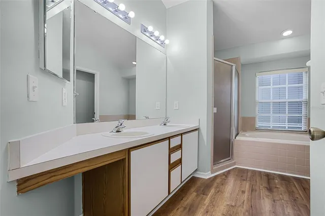 a bathroom with a tub and a sink