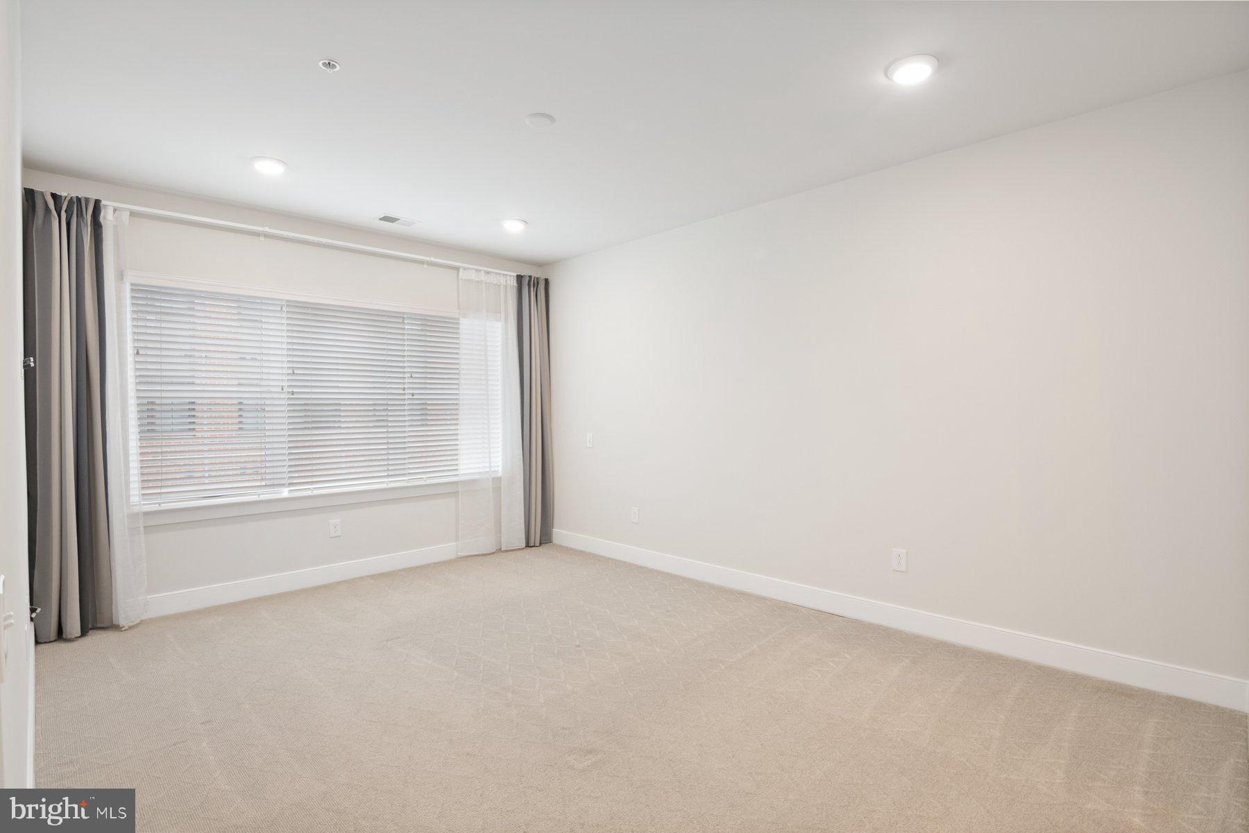 2907 Bleeker Street, Unit 204 Fairfax, VA 22031 - Photo 11 of 20 a view of an empty room with a window