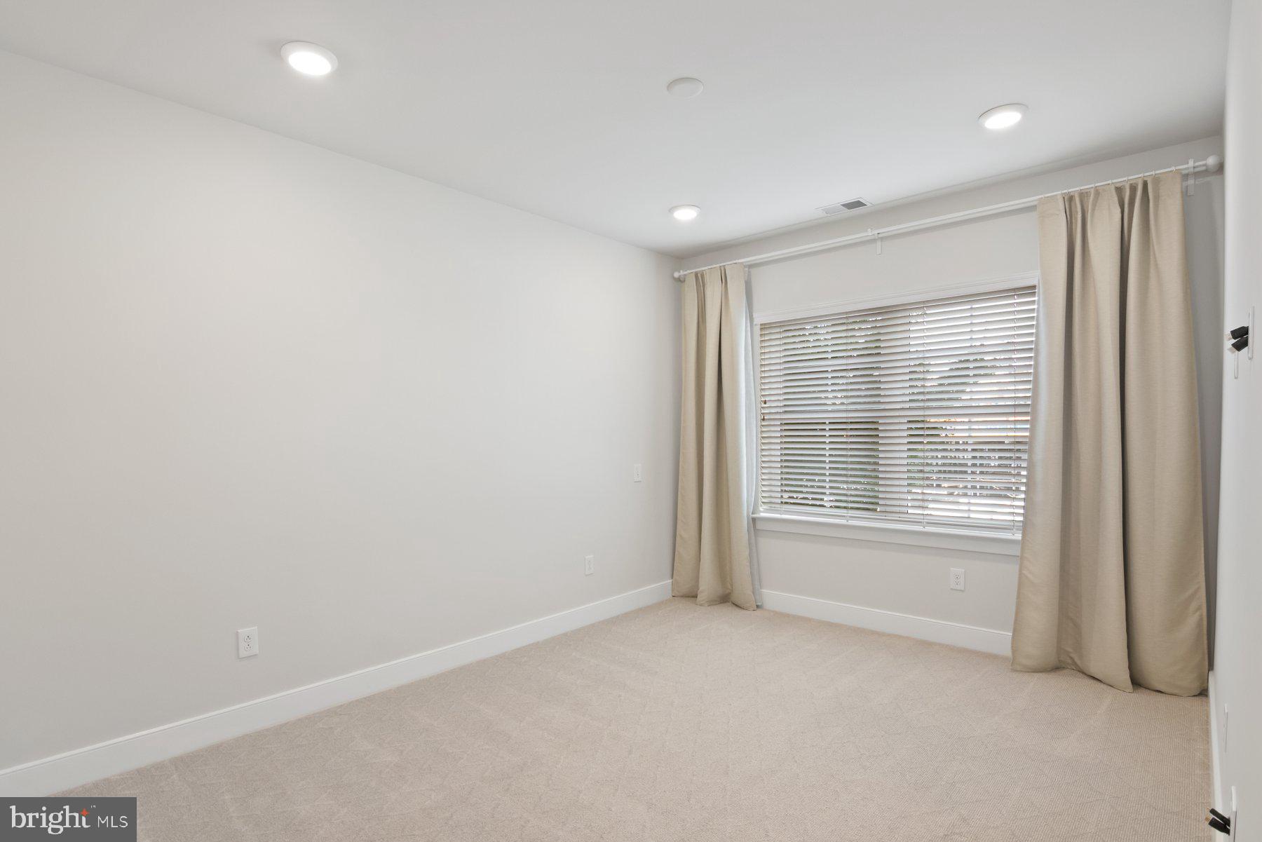 2907 Bleeker Street, Unit 204 Fairfax, VA 22031 - Photo 15 of 20 a view of an empty room with a window