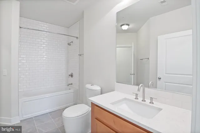 a view of a city street with a car parked