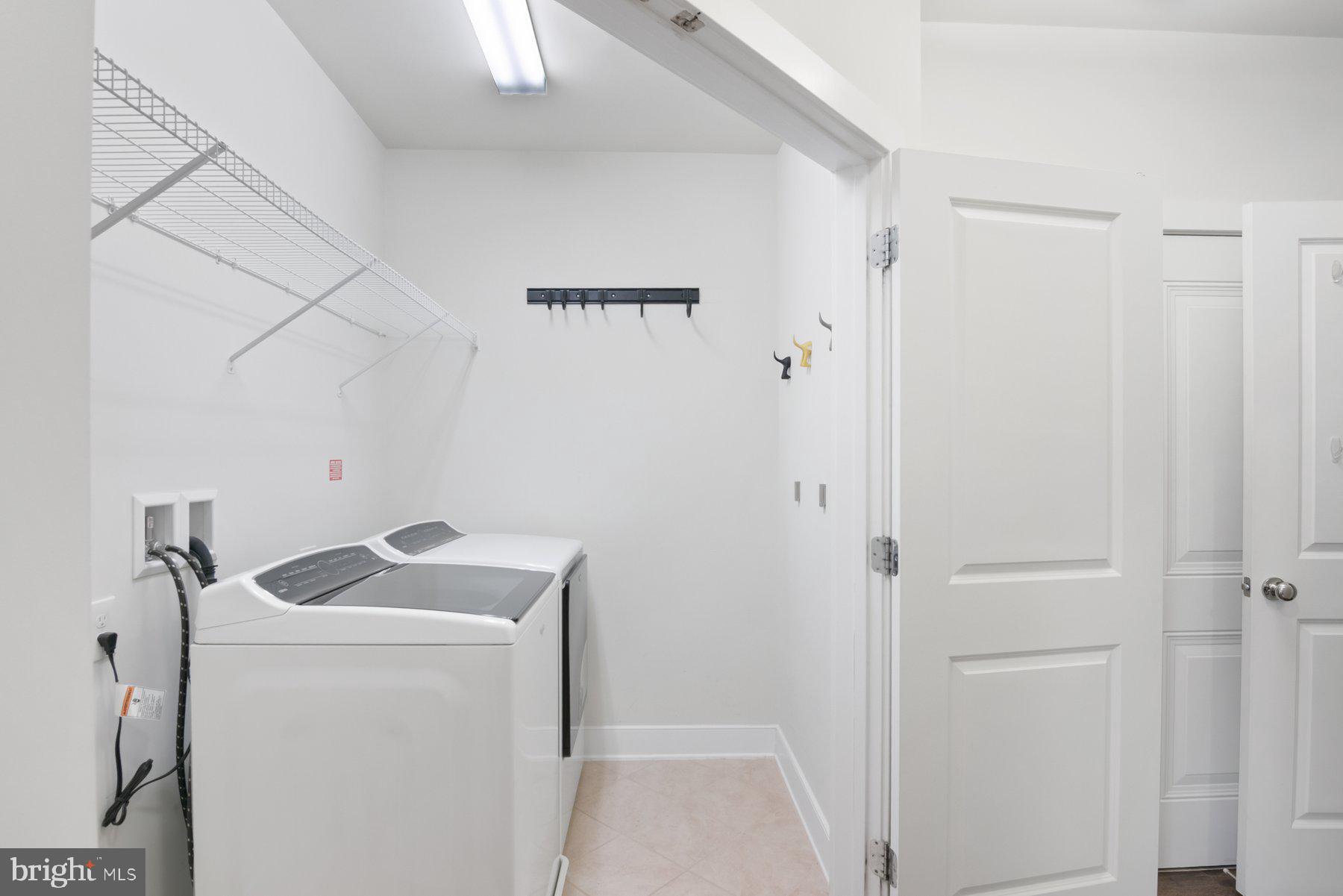 2907 Bleeker Street, Unit 204 Fairfax, VA 22031 - Photo 18 of 20 a utility room with dryer and washer