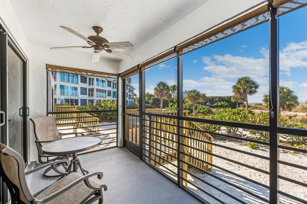 5000 Gasparilla Road, Unit BC103 Boca Grande, FL 33921 - Photo 12 of 36 a view of a porch with furniture and a gate