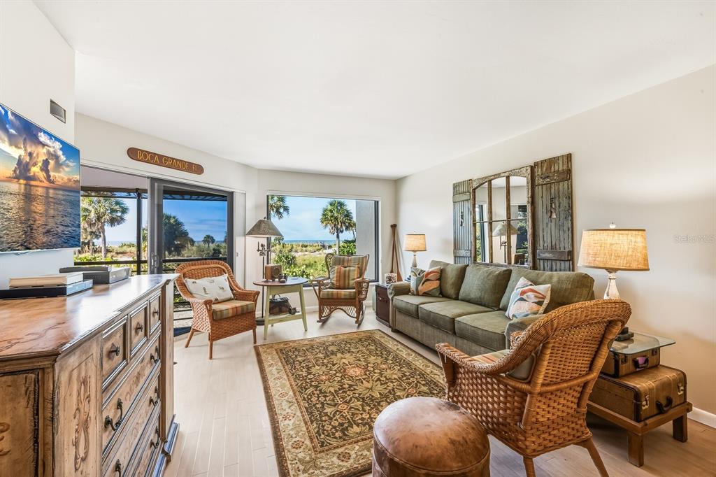 5000 Gasparilla Road, Unit BC103 Boca Grande, FL 33921 - Photo 4 of 36 a living room with furniture and a large window