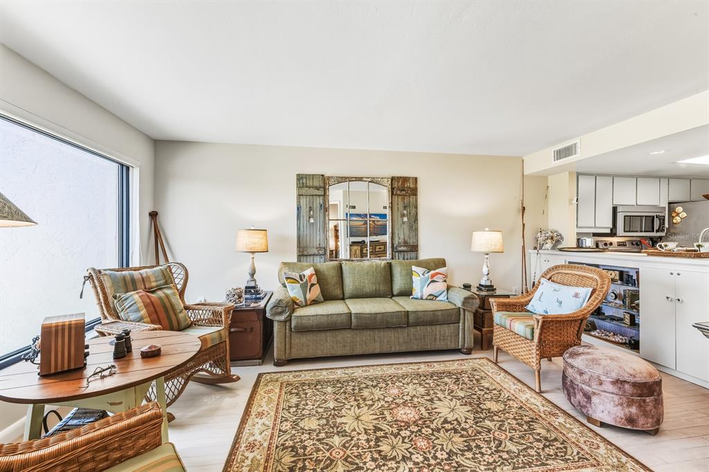 5000 Gasparilla Road, Unit BC103 Boca Grande, FL 33921 - Photo 5 of 36 a living room with furniture and a window