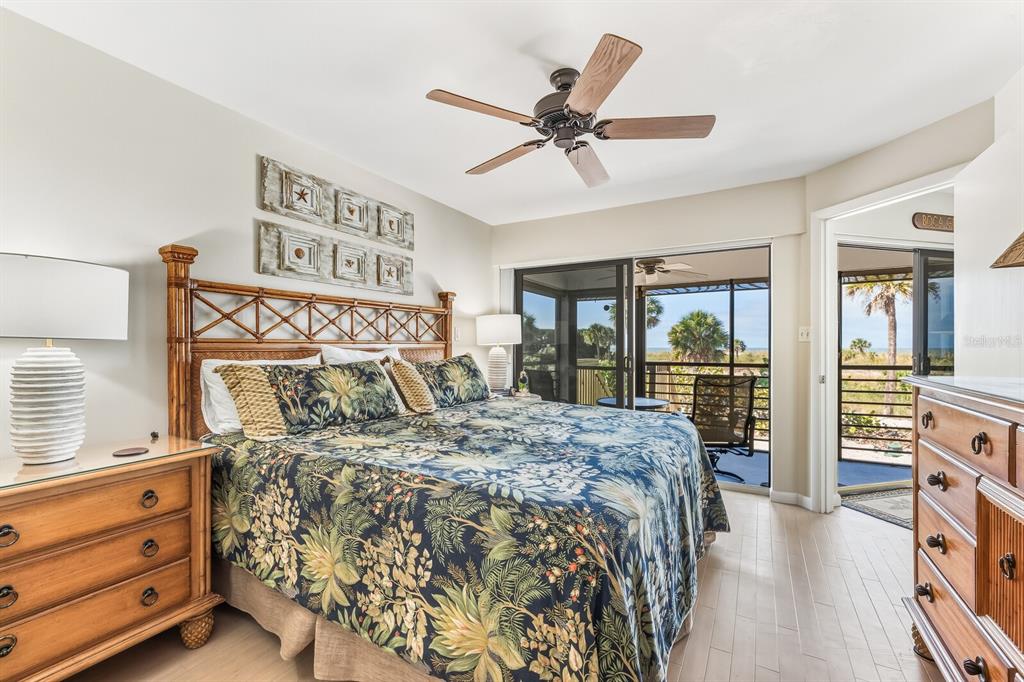 5000 Gasparilla Road, Unit BC103 Boca Grande, FL 33921 - Photo 9 of 36 a bed sitting in a bedroom next to a window