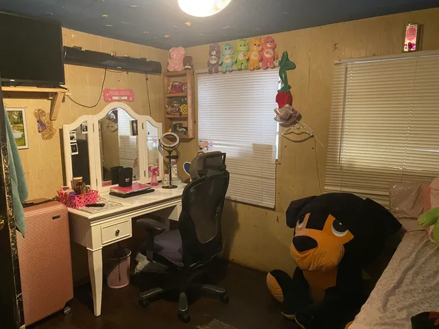 a room with a table and chairs