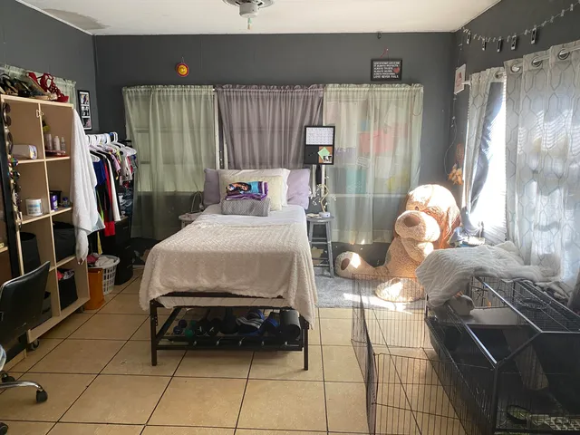 a bedroom with a bed and a walk in closet