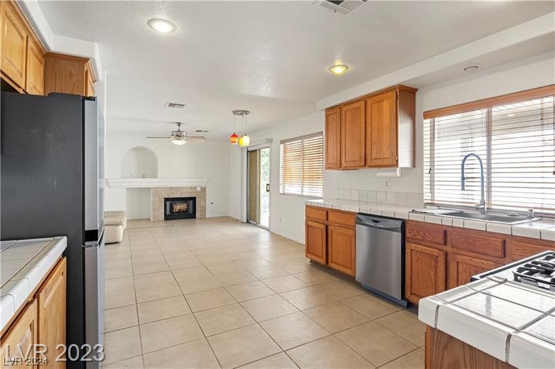 1822 Dawn Ridge Avenue Henderson, NV 89074 - Photo 8 of 33 Kitchen and adjoining family room.