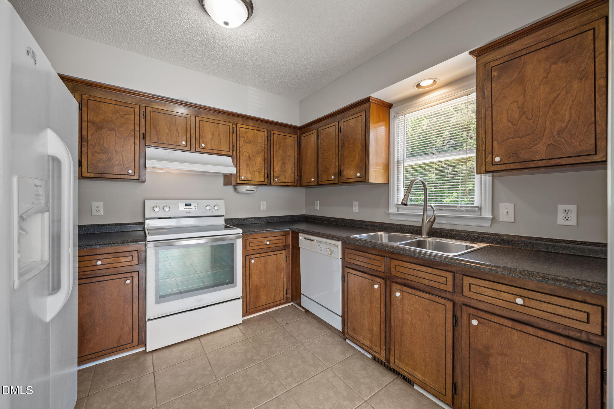 40 Circle Tree Lane Angier, NC 27501 - Photo 13 of 39 a kitchen with granite countertop a sink stainless steel appliances and cabinets