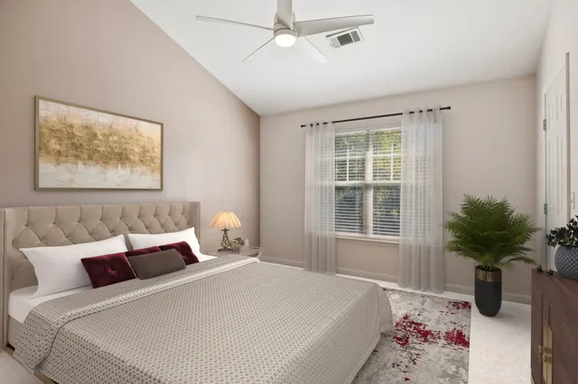 a bedroom with bed and a window