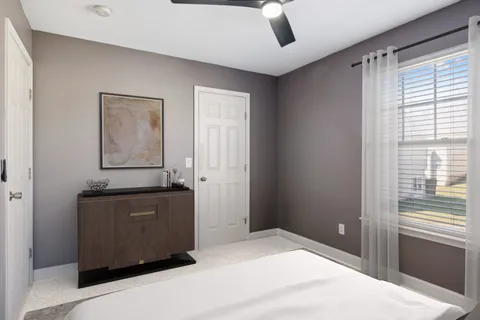 a room with window and cabinet