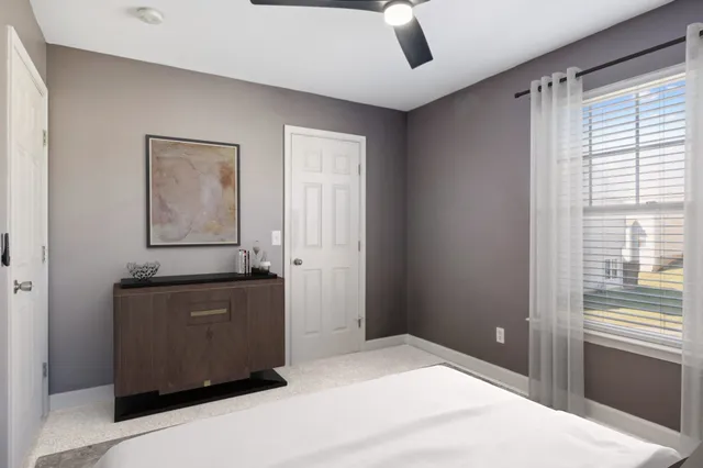 a room with window and cabinet