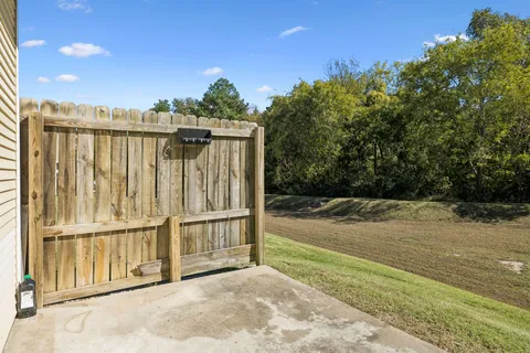 a view of a backyard of the house