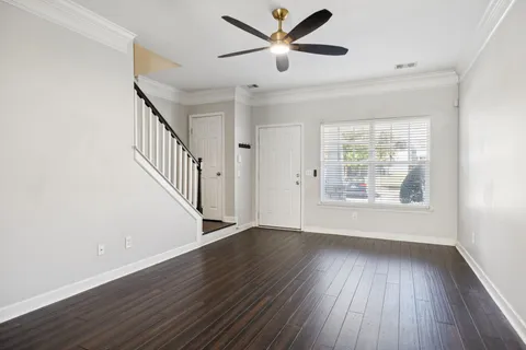 wooden floor in an empty room with a window