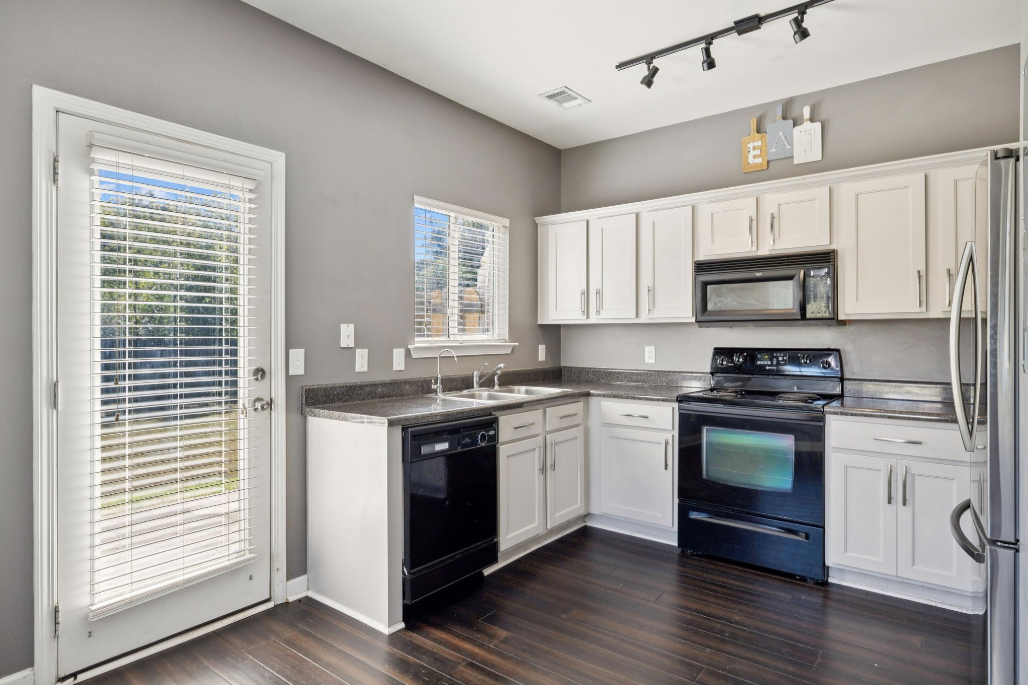 1832 Lincoya Bay Drive Nashville, TN 37214 - Photo 29 of 33 a kitchen with a stove a sink and a microwave