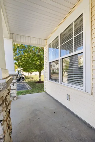 a view of a house with a yard and garage