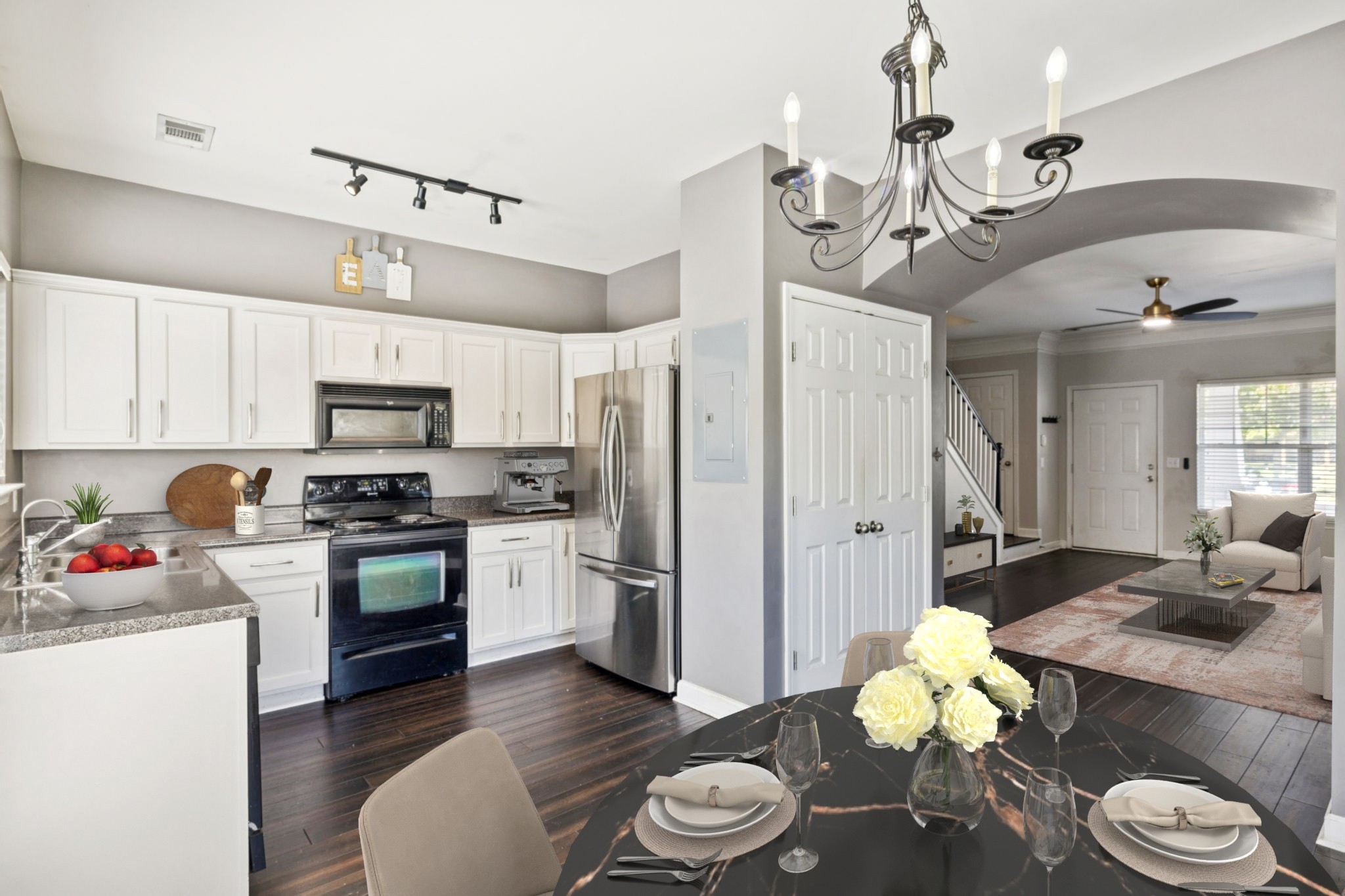 1832 Lincoya Bay Drive Nashville, TN 37214 - Photo 7 of 33 a kitchen with stainless steel appliances kitchen island granite countertop a refrigerator a stove a sink dishwasher and white cabinets with wooden floor