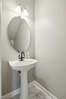 a bathroom with a sink and mirror