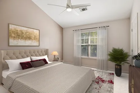 a bedroom with bed and a window