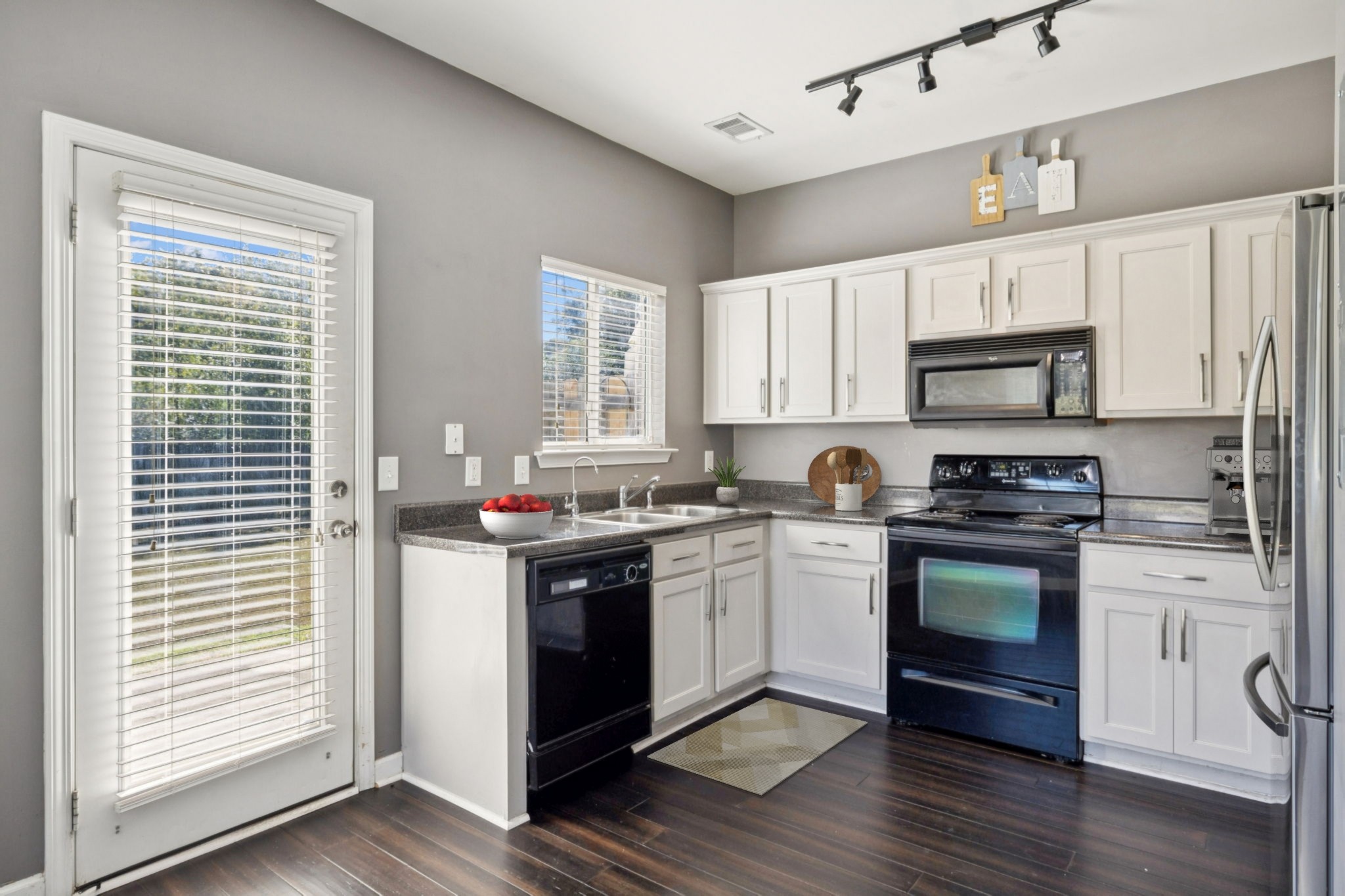 1832 Lincoya Bay Drive Nashville, TN 37214 - Photo 10 of 33 a kitchen with a stove a sink and a microwave
