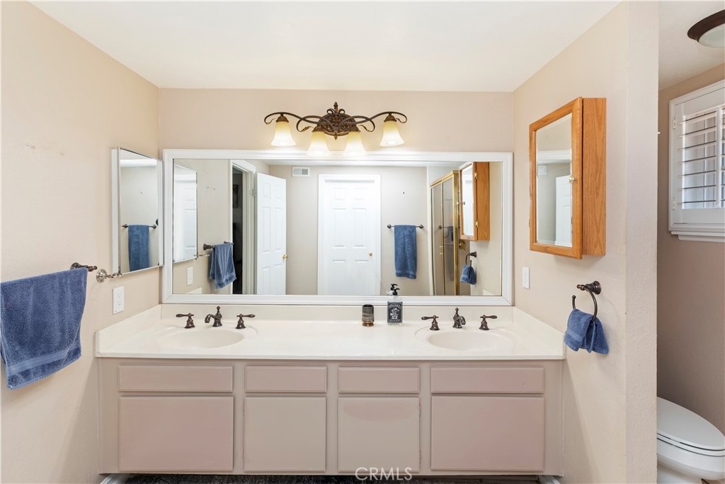 6225 Promontory Lane Riverside, CA 92506 - Photo 12 of 20 a bathroom with a sink and a mirror