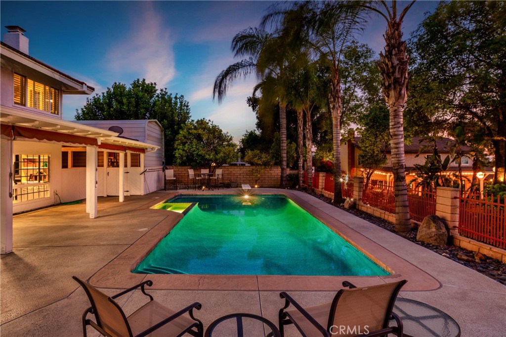6225 Promontory Lane Riverside, CA 92506 - Photo 17 of 20 a view of a backyard with furniture and a swimming pool