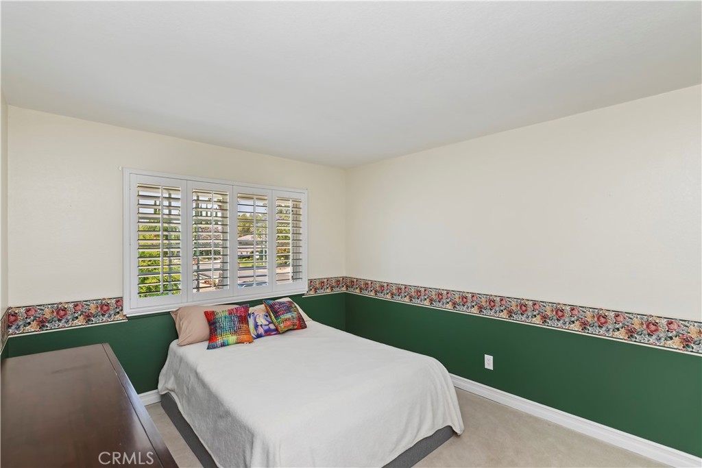 6225 Promontory Lane Riverside, CA 92506 - Photo 8 of 20 a bed sitting in a bedroom next to a window