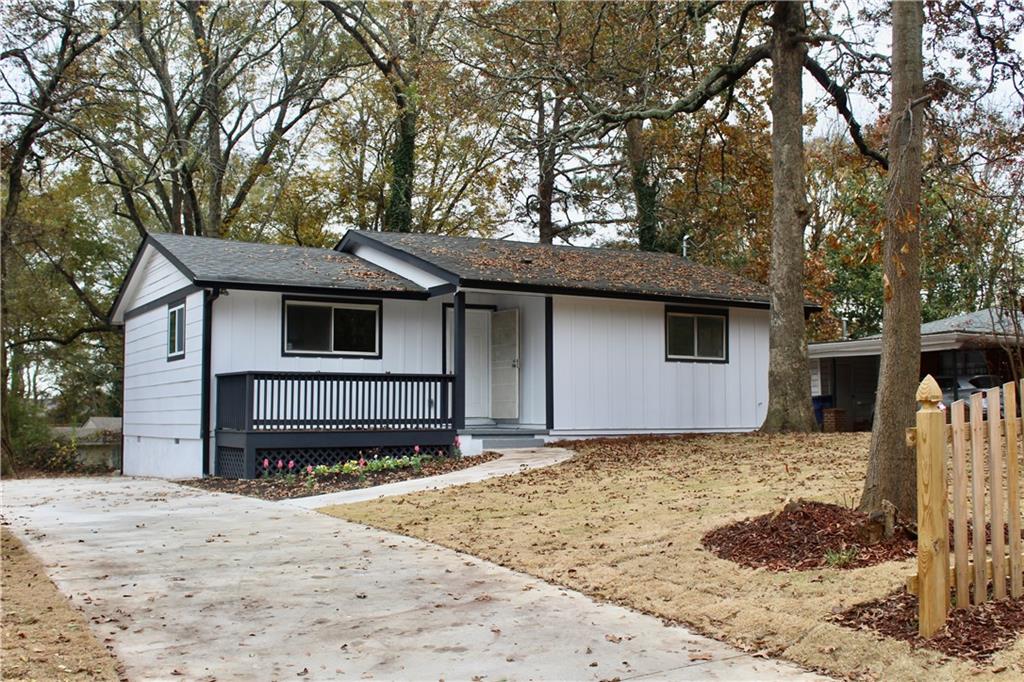 1127 Valley View Road Southeast Atlanta, GA 30315 - Photo 1 of 1 a front view of a house with a yard covered in snow