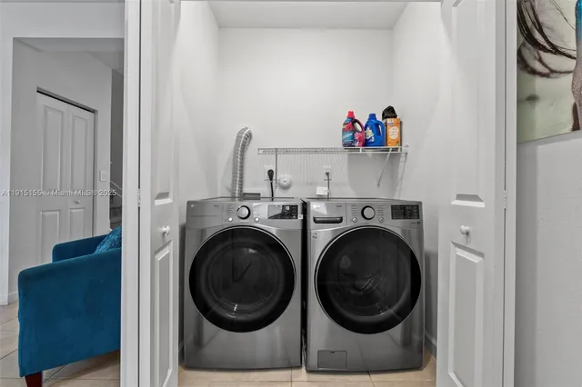 a utility room with dryer and washer