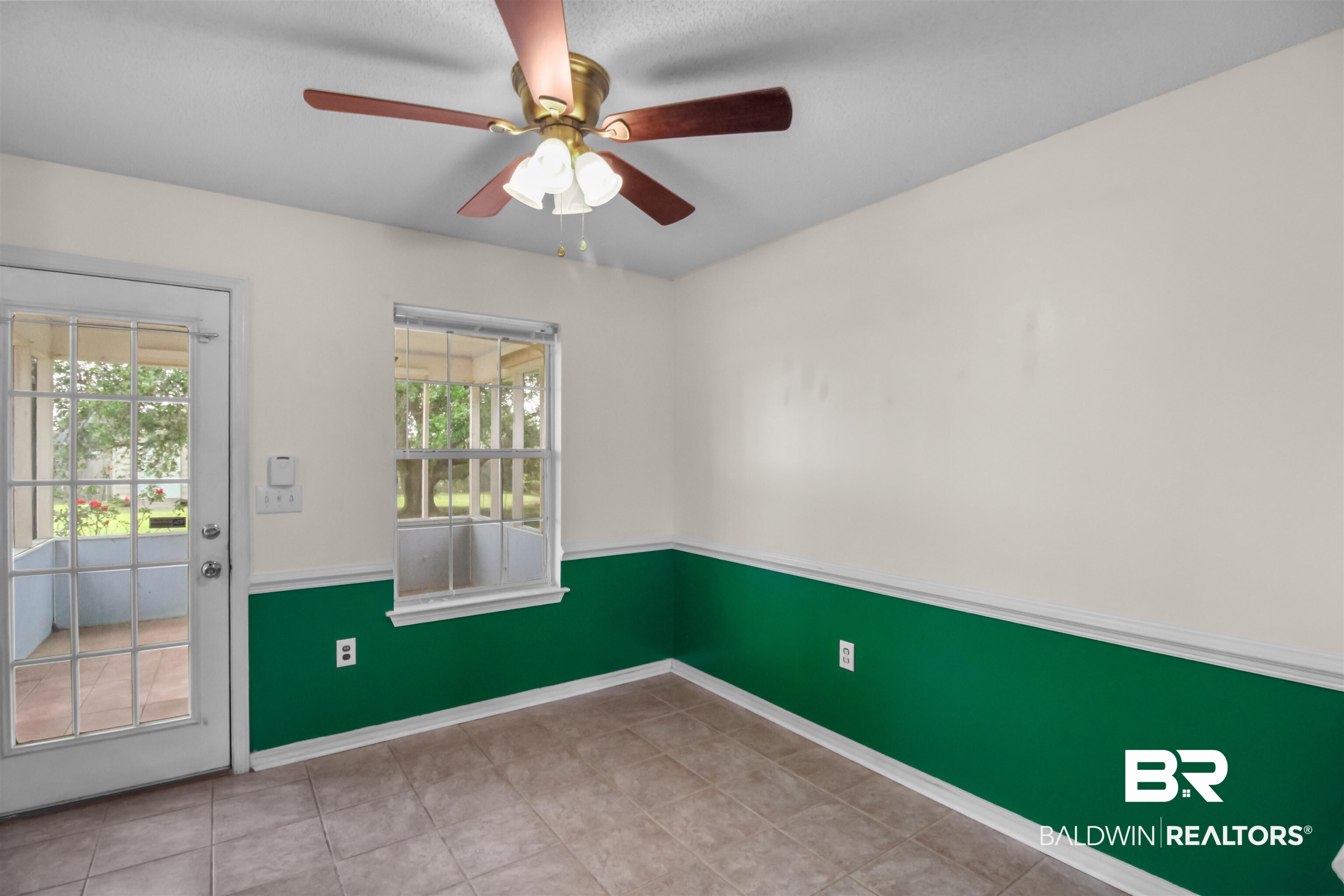 8940 Caitlin Street Foley, AL 36535 - Photo 12 of 27 Empty room featuring a ceiling fan and light tile patterned flooring