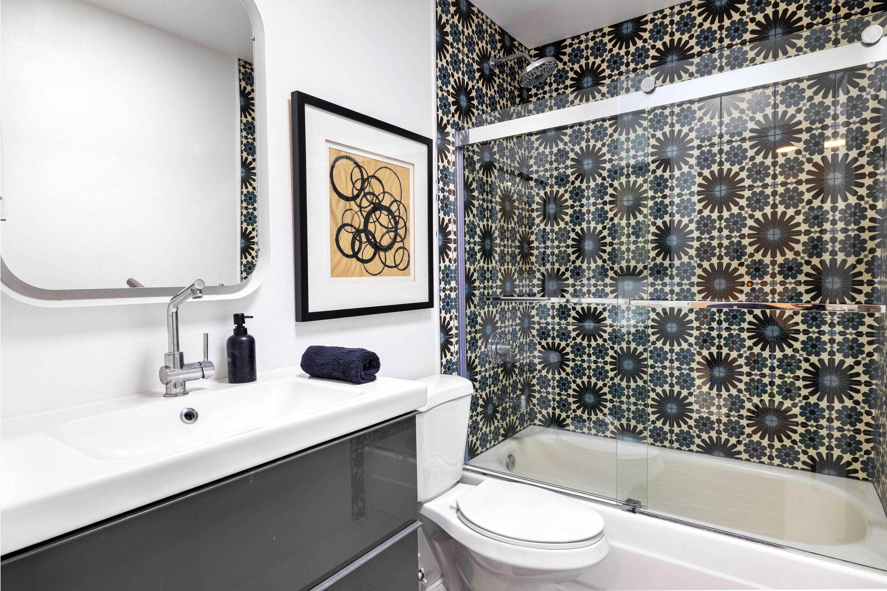 250 East Via Escuela, Unit G Palm Springs, CA 92262 - Photo 18 of 25 a bathroom with a sink toilet and shower