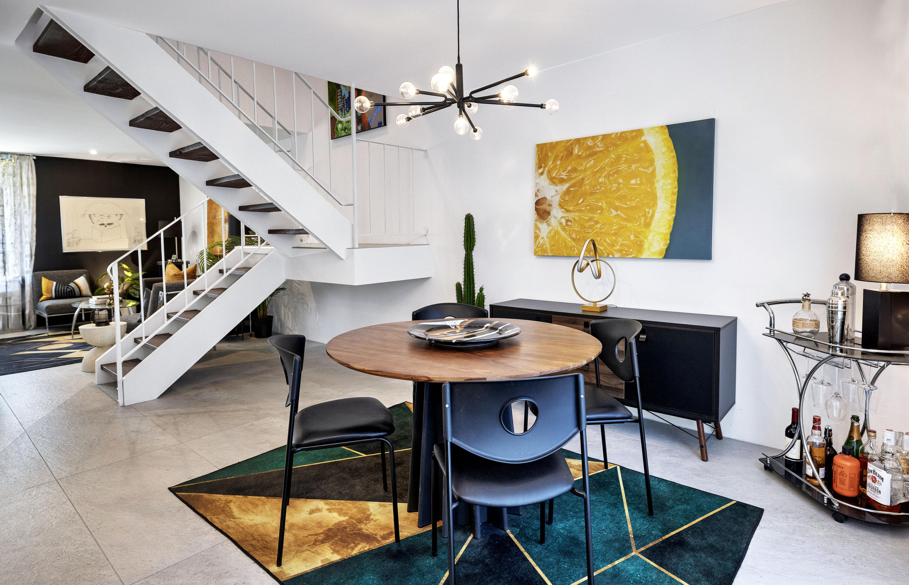 250 East Via Escuela, Unit G Palm Springs, CA 92262 - Photo 5 of 25 a dining room with furniture and wooden floor