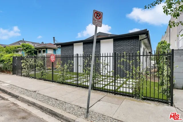 a view of a brick house with a street view