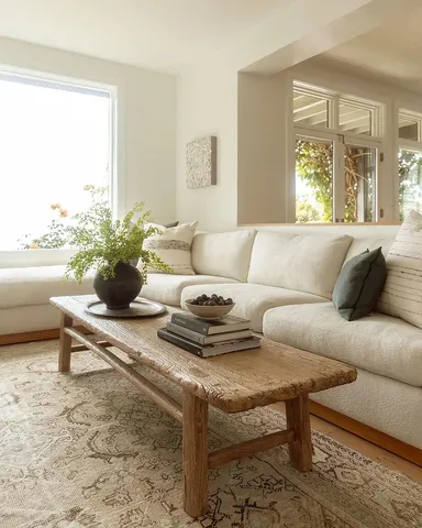 a bedroom with a bed and a mirror on dresser