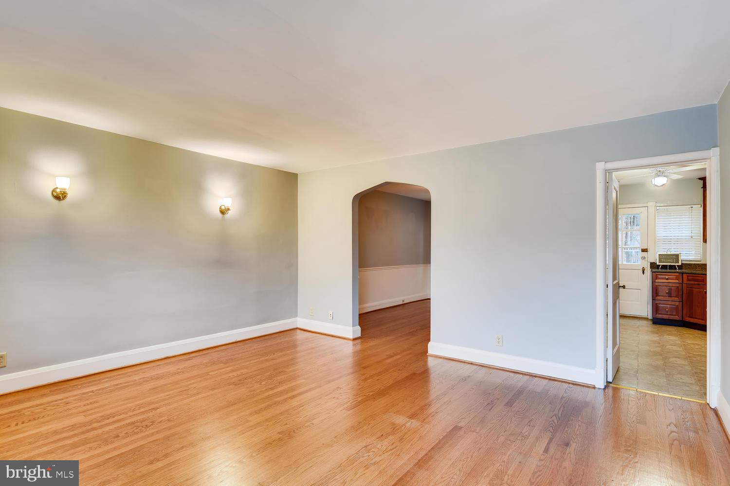 41 Murdock Road Baltimore, MD 21212 - Photo 3 of 30 Living room with sconces and hardwood floors
