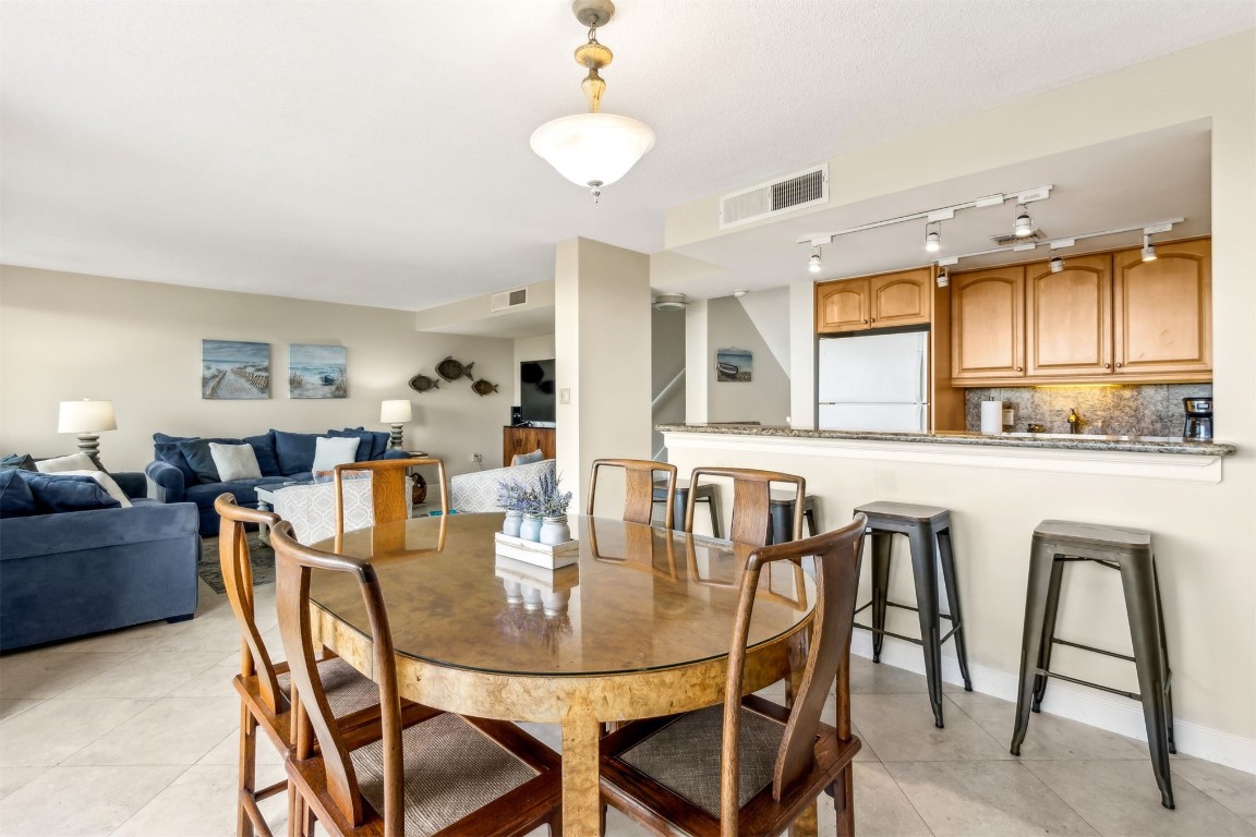 1107 Beach Walker Road, Unit 1107 Fernandina Beach, FL 32034 - Photo 12 of 63 a dining room with furniture and window