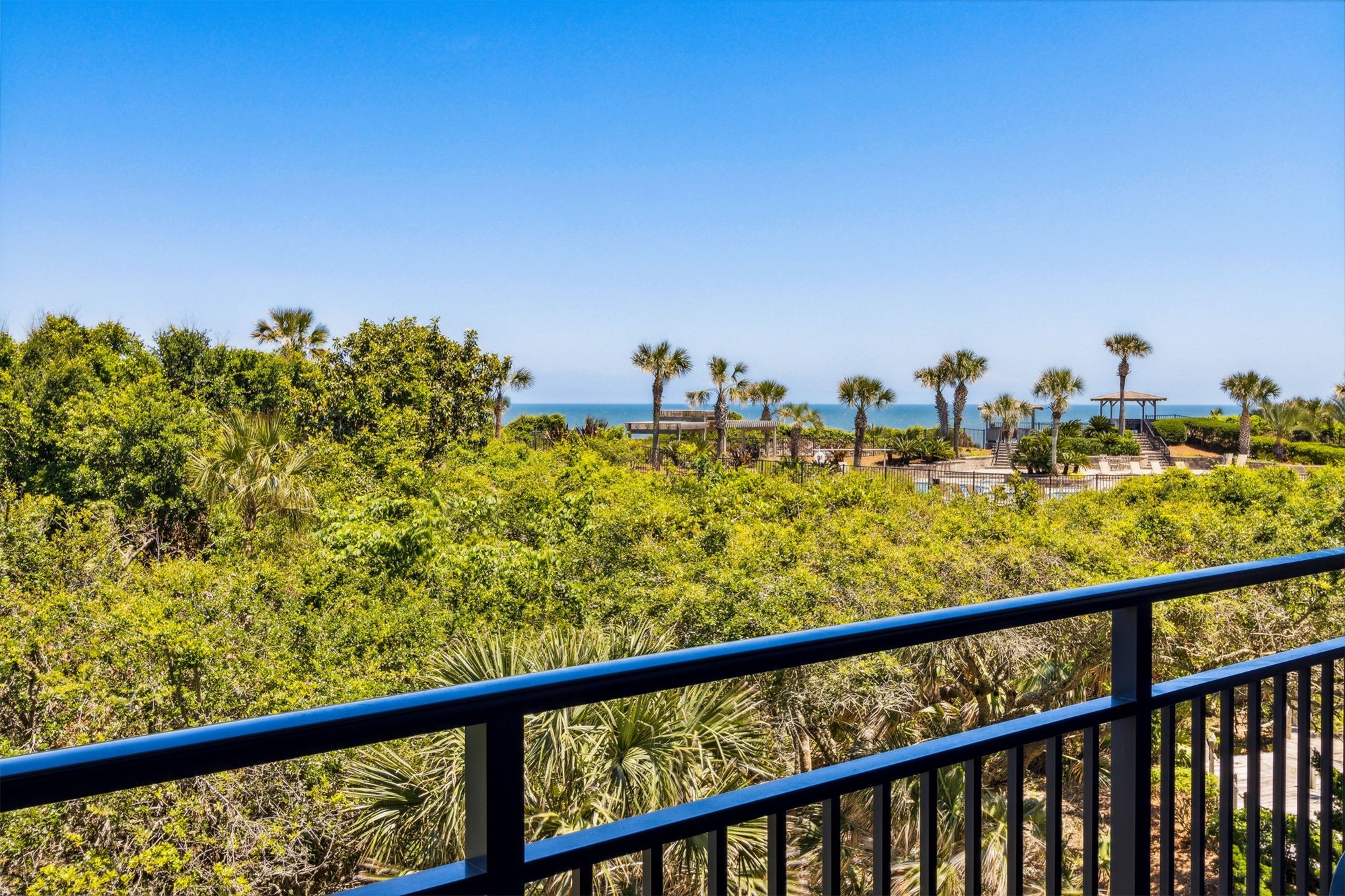 1107 Beach Walker Road, Unit 1107 Fernandina Beach, FL 32034 - Photo 17 of 63 a view of a balcony next to a yard