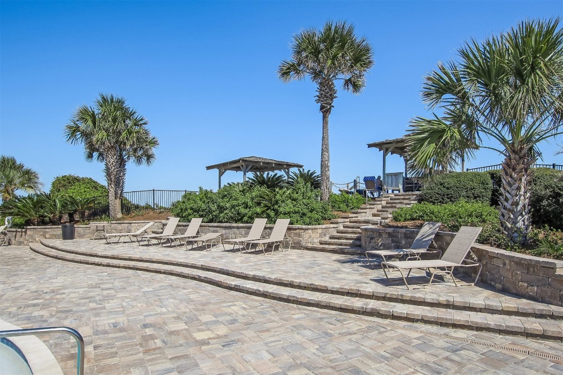 1107 Beach Walker Road, Unit 1107 Fernandina Beach, FL 32034 - Photo 38 of 63 a view of a swimming pool with a table and chairs