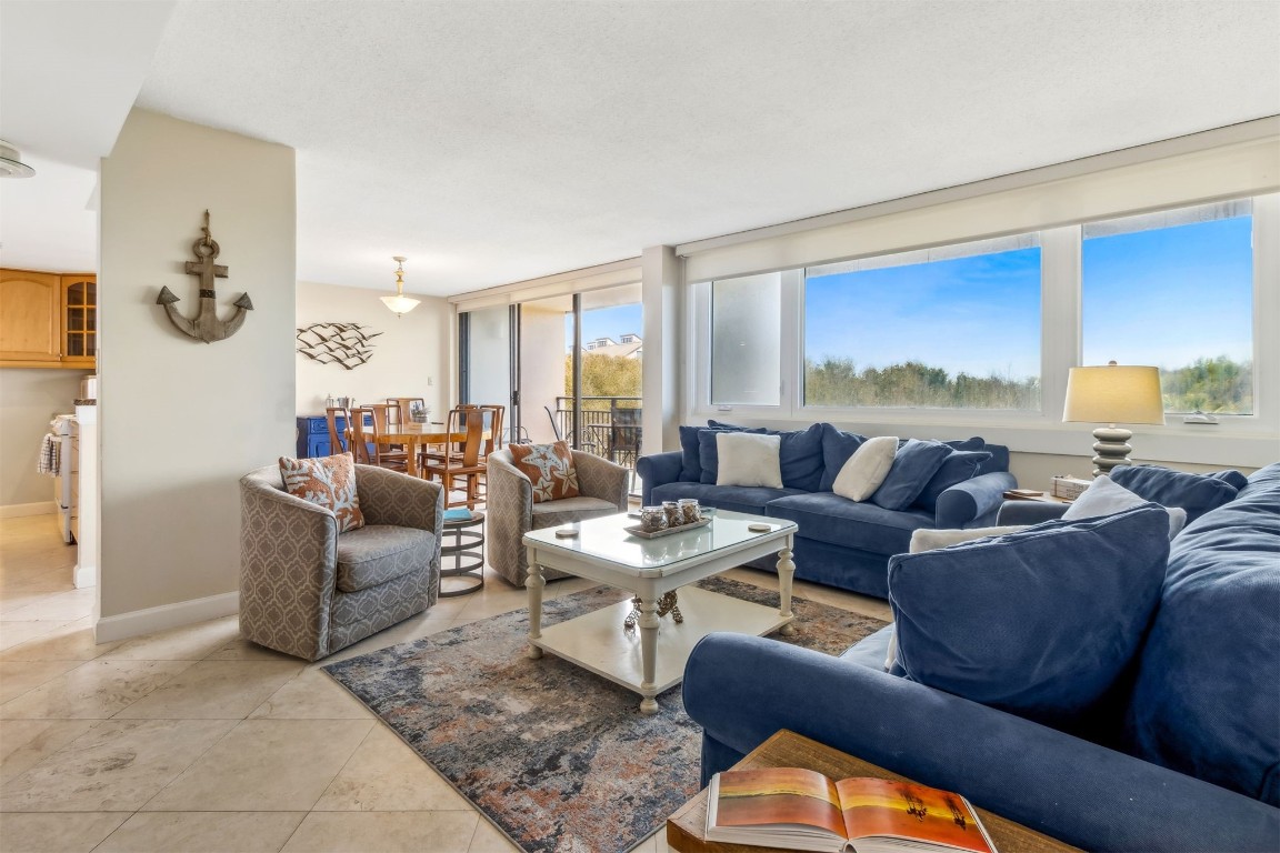 1107 Beach Walker Road, Unit 1107 Fernandina Beach, FL 32034 - Photo 63 of 63 a living room with furniture and a large window