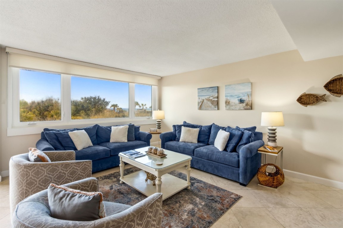 1107 Beach Walker Road, Unit 1107 Fernandina Beach, FL 32034 - Photo 9 of 63 a living room with furniture and a large window