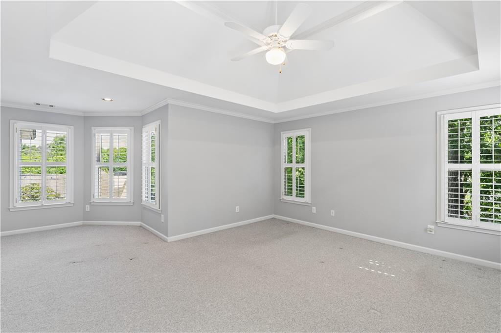 520 Redding View Court Northwest Sandy Springs, GA 30328 - Photo 14 of 27 an empty room with windows and fan