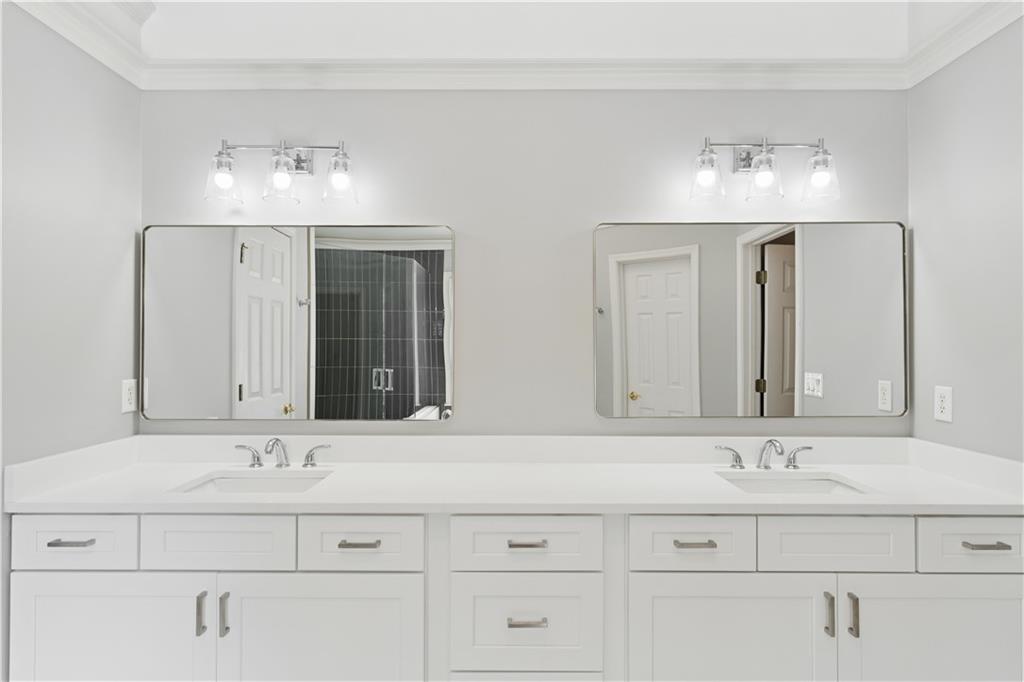 520 Redding View Court Northwest Sandy Springs, GA 30328 - Photo 16 of 27 a bathroom with double vanity sinks vanity and a mirror