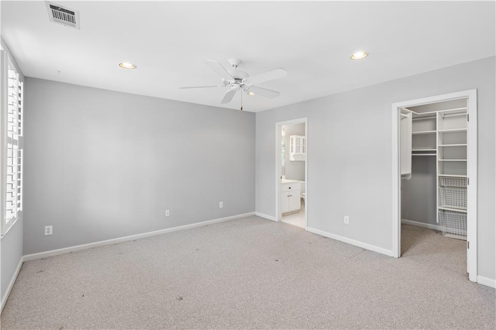 520 Redding View Court Northwest Sandy Springs, GA 30328 - Photo 17 of 27 an empty room with closet and a ceiling fan